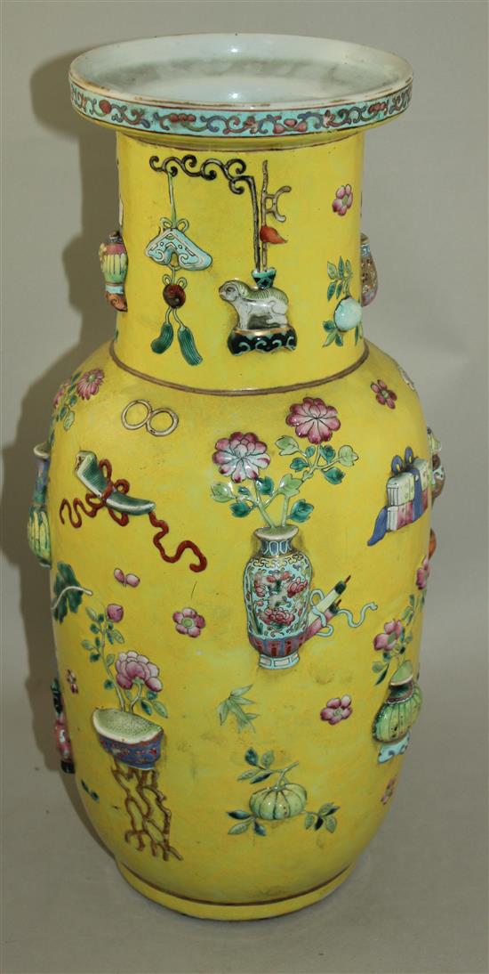 A large Chinese yellow ground and moulded Hundred Antiques vase, 19th century, 44cm